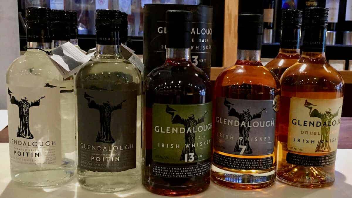 GlendaloughIrish Whiskey lineup in bottles on a counter.