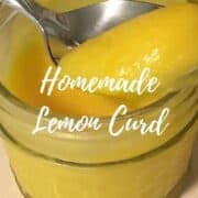 Lemon curd on a spoon over a jar Pinterest banner.