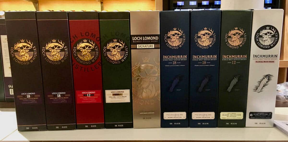 Loch Lomond whisky lineup boxes on a counter.