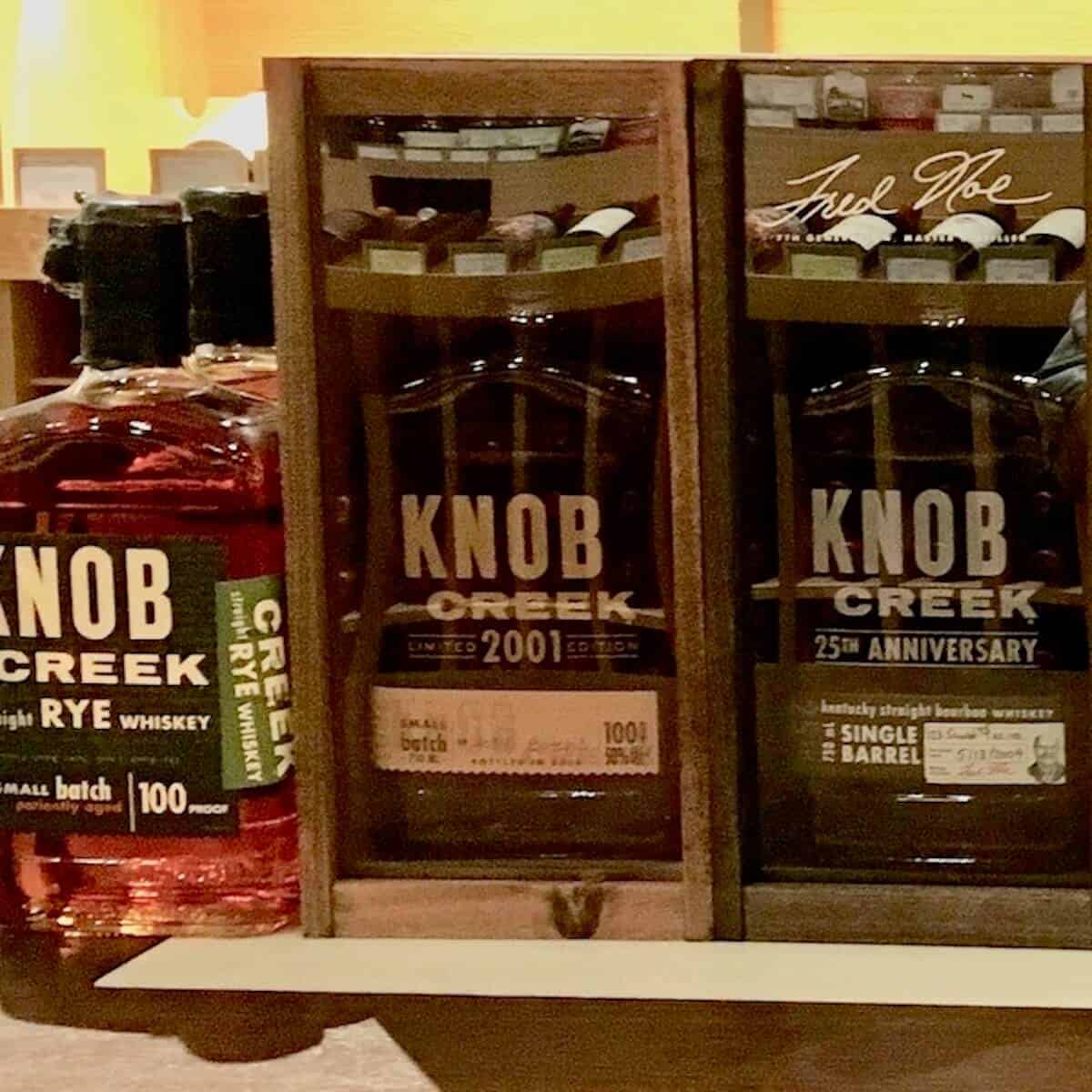 Knob Creek lineup bottles on a counter.