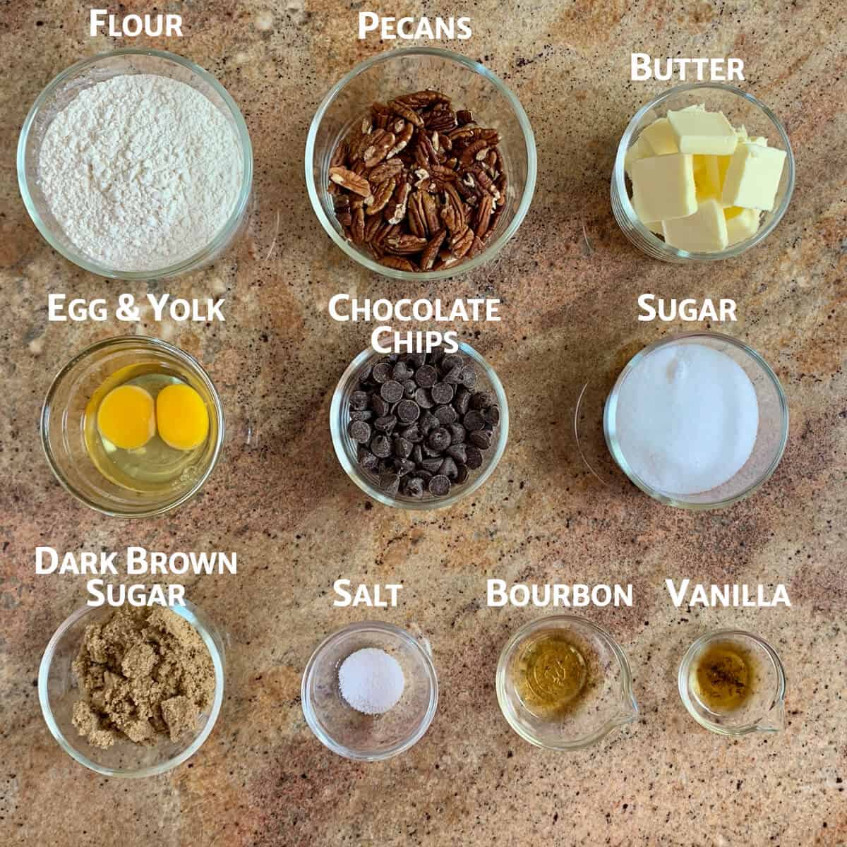 Ingredients for pecan bars portioned into glass bowls from overhead.