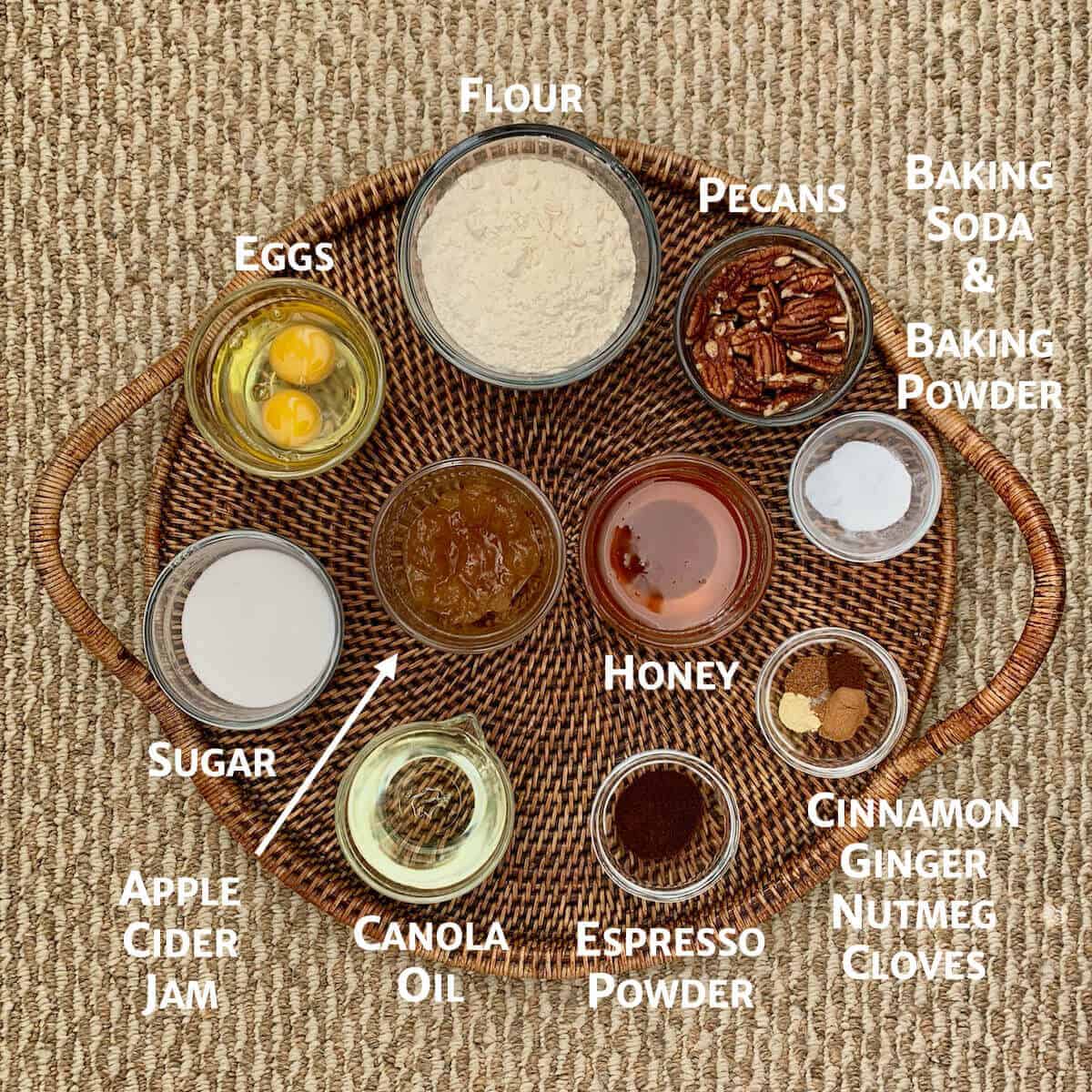 Honey cake ingredients portioned into glass bowls.