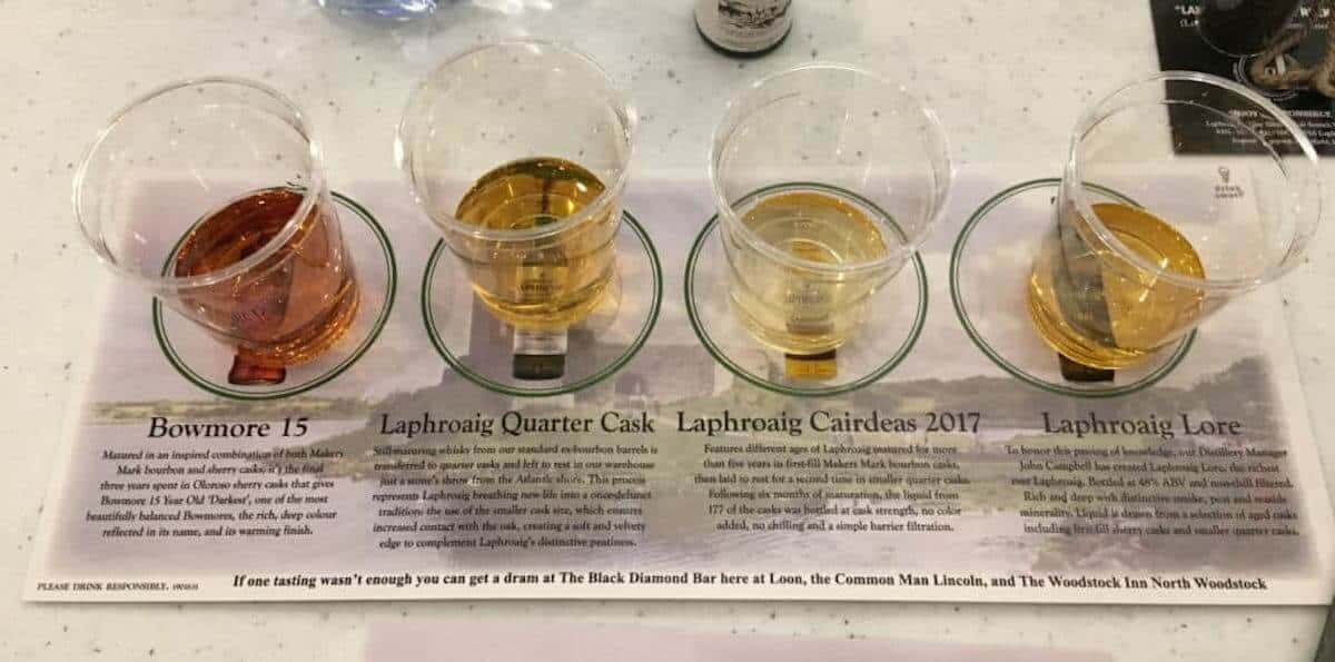 Laphroaig and Bowmore scotch tasting lineup on a sample mat.