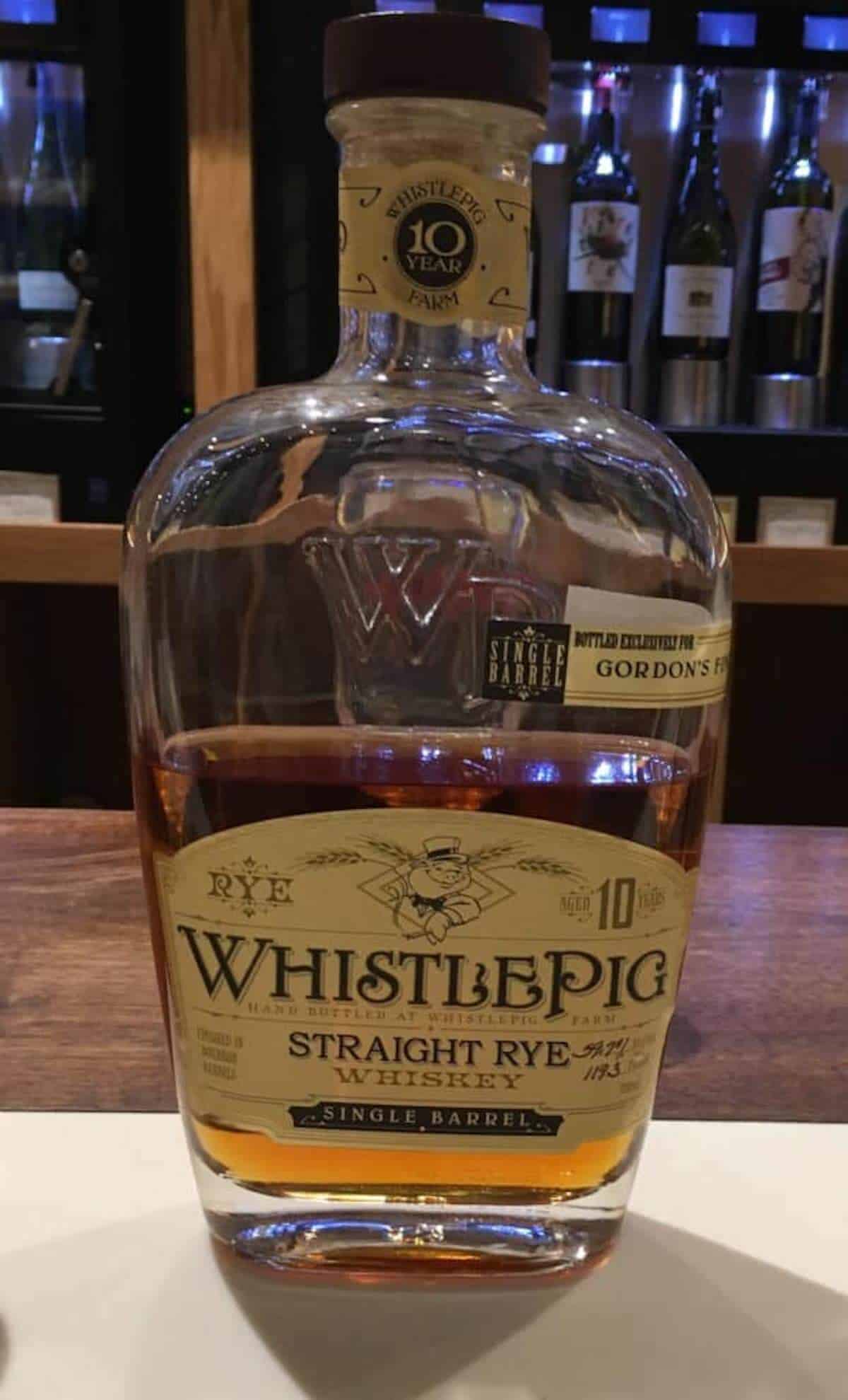 WhistlePig Straight Rye Whiskey 10 year bottle on a counter.
