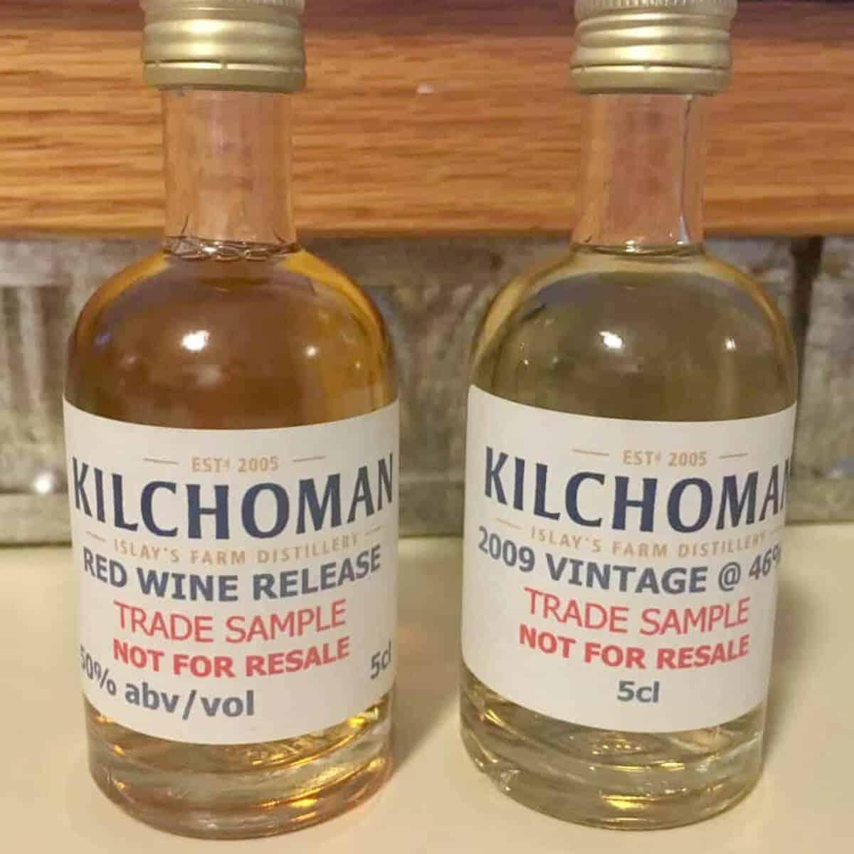 Kilchoman sample bottles with the labels on a counter.