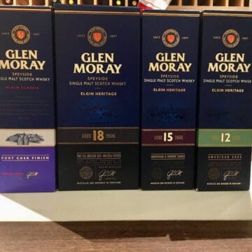 Glen Moray whisky box lineup on a counter.