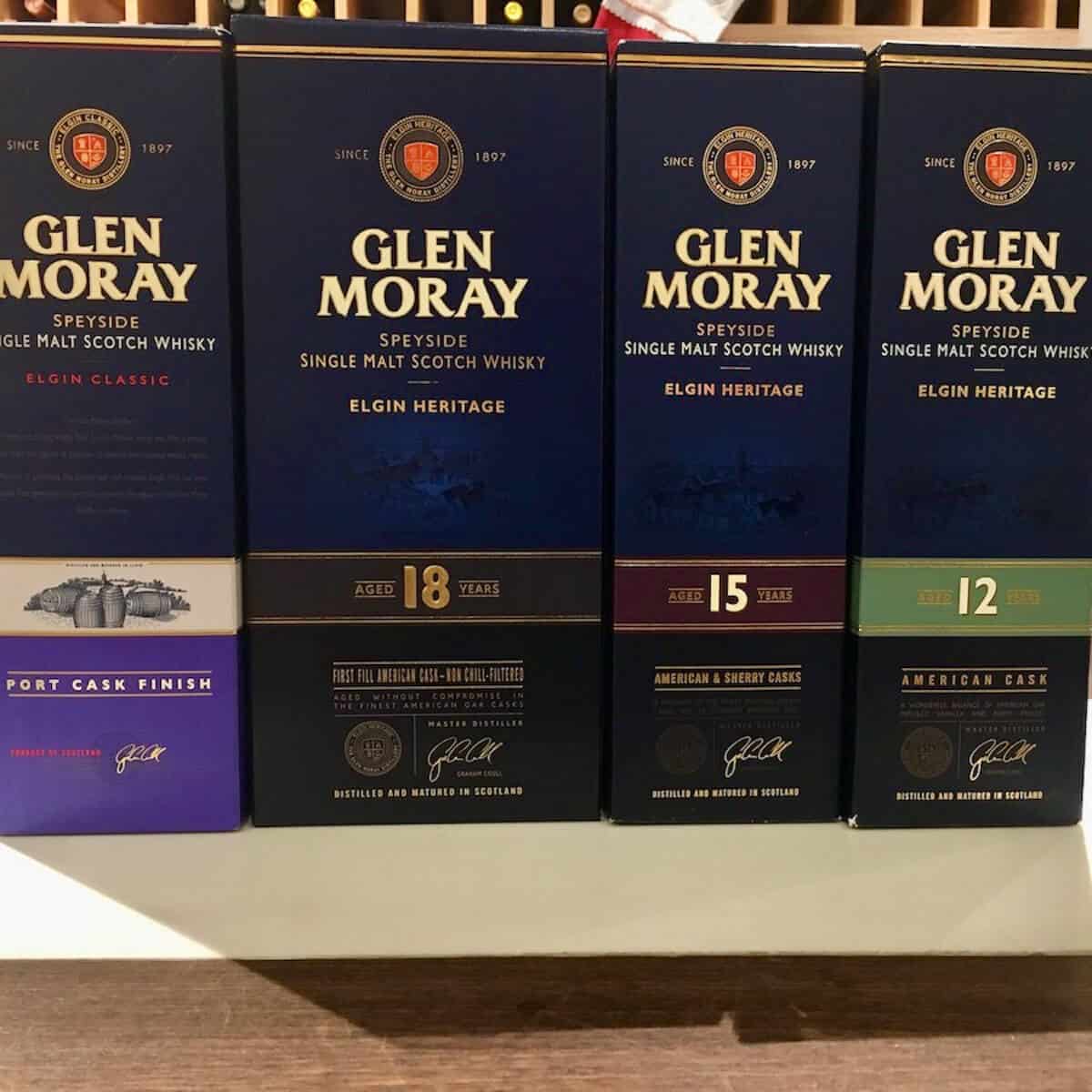 Glen Moray whisky box lineup on a counter.