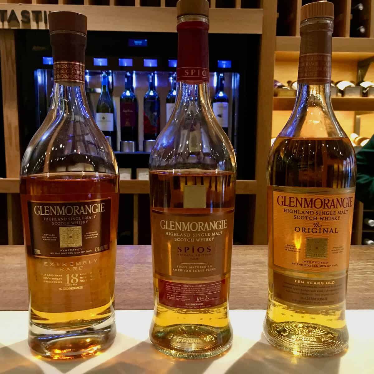 Glenmorangie Original, Spios, and Extremely Rare in bottles on a counter.