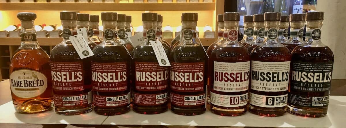 Wild Turkey & Russell’s Reserve lineup in bottles on a counter.