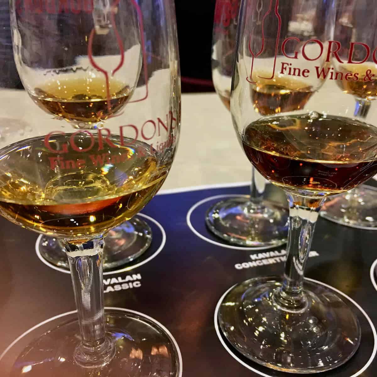 Kavalan whisky seminar tasting lineup in glasses on a sample mat.