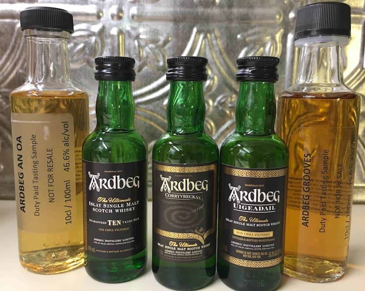 Ardbeg Day sample lineup bottles on a counter.