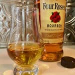 Four Roses Bourbon bottle with poured glass