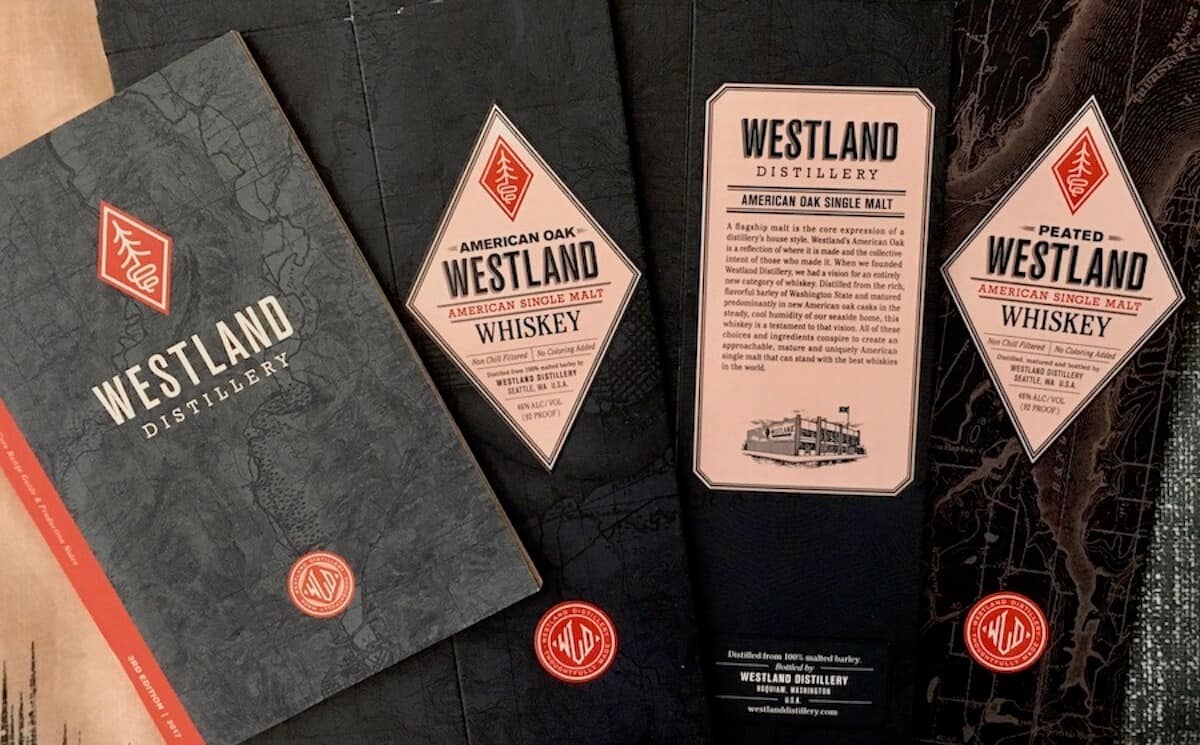 Westland American Single Malt Distillery info fanned out on a table.