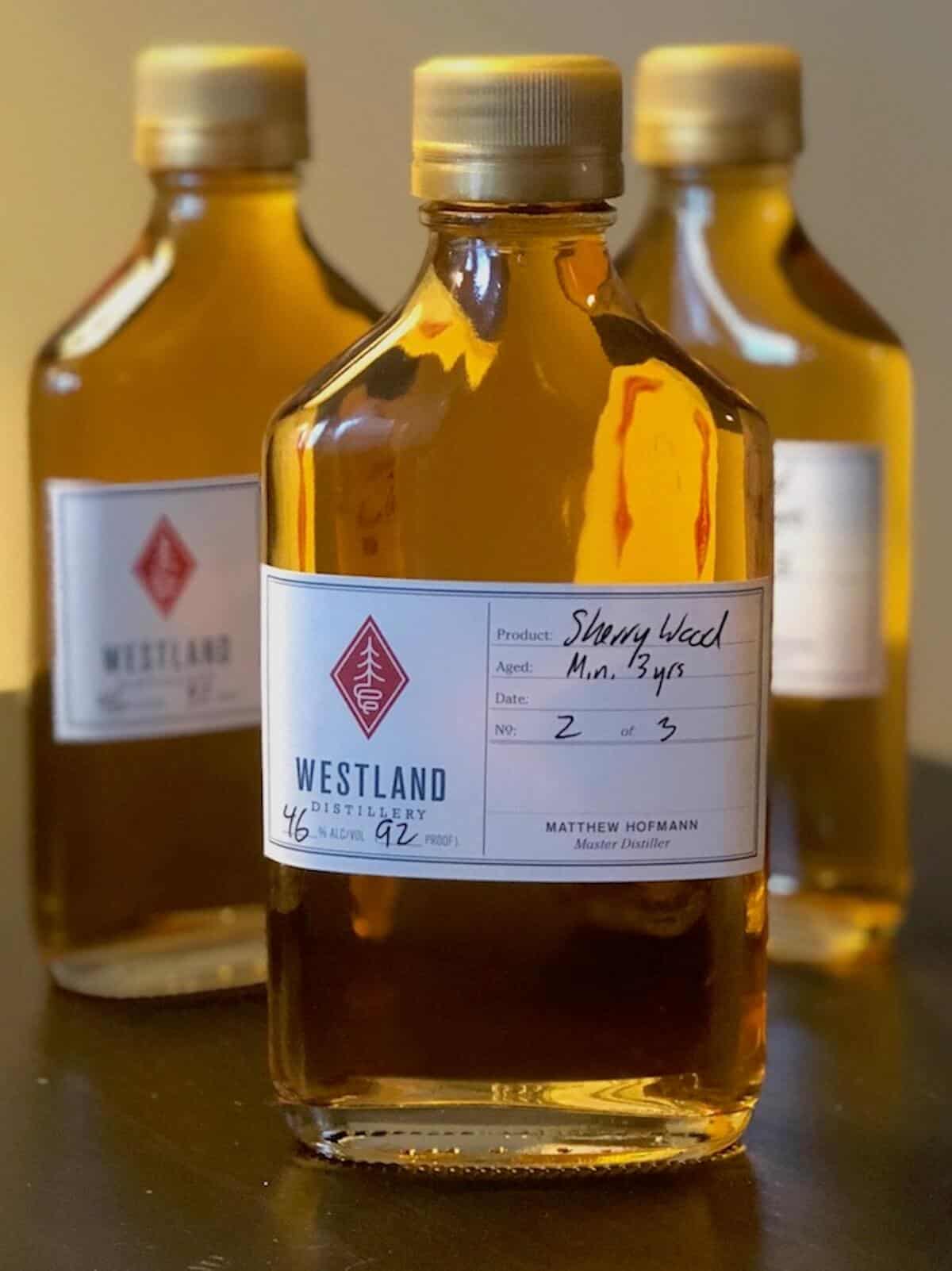 Westland American Single Malt sample bottles on a table with Sherry Wood in foreground.