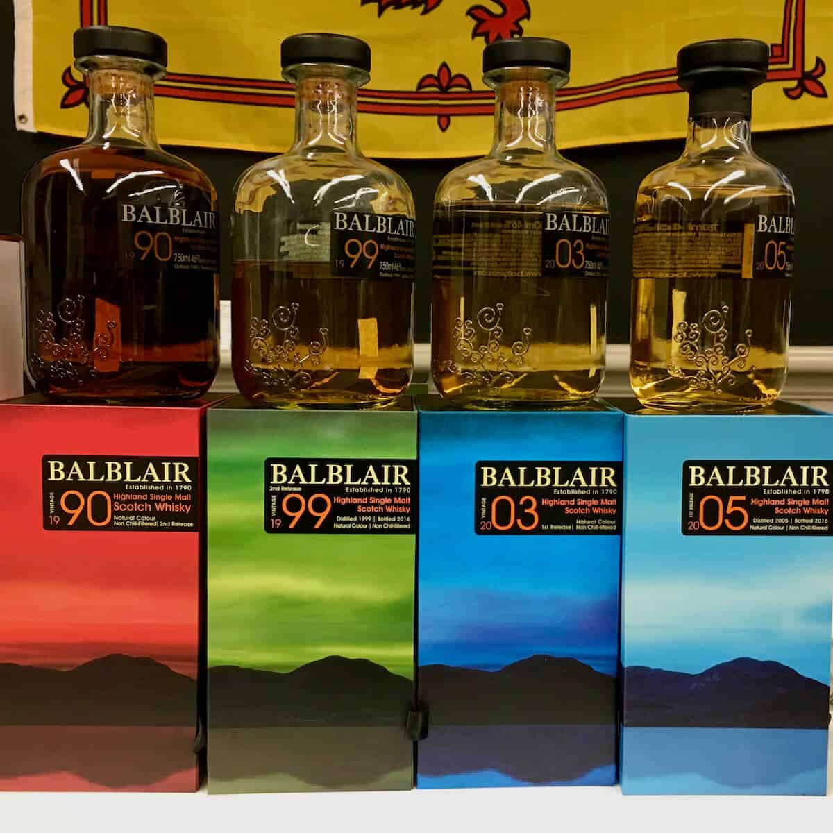 Balblair lineup in bottles on top of their boxes.