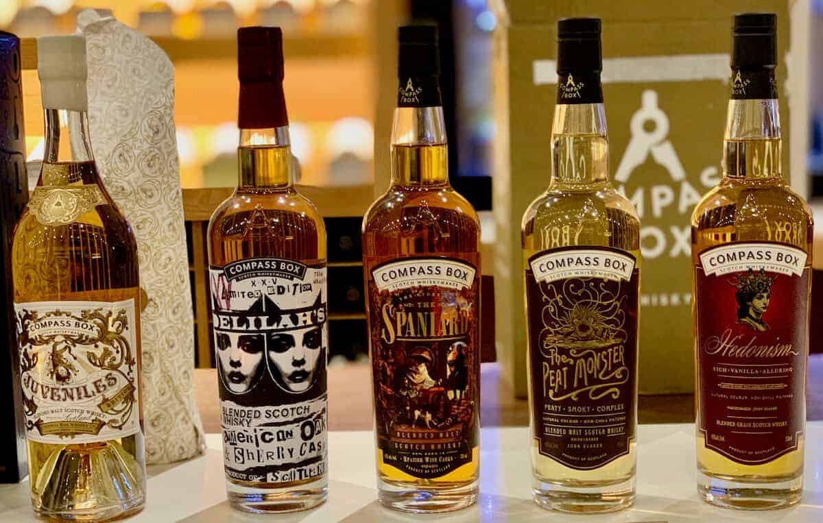 Compass Box Blended Scotch lineup in bottles on a counter.