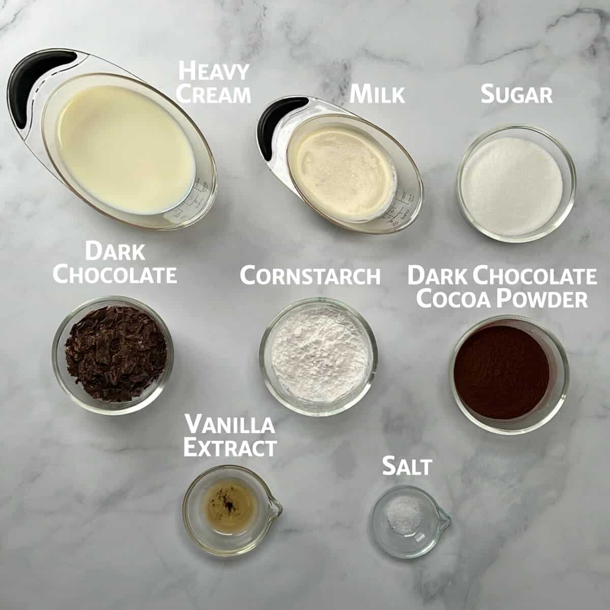 Ingredients for Dark Chocolate Pudding portioned into glass bowls.