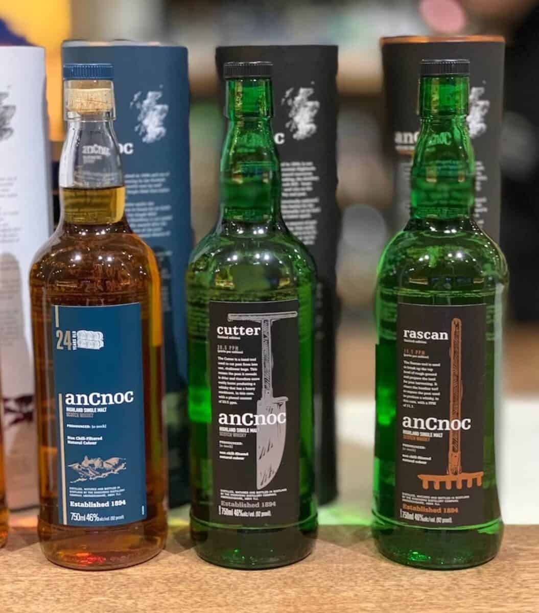 anCnoc rascan, cutter, and 24 in bottles on a counter.