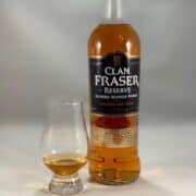 Clan Fraser Reserve blended scotch bottle with poured glass next to it.