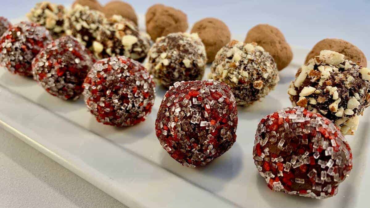 Chocolate Truffles on a white plate.