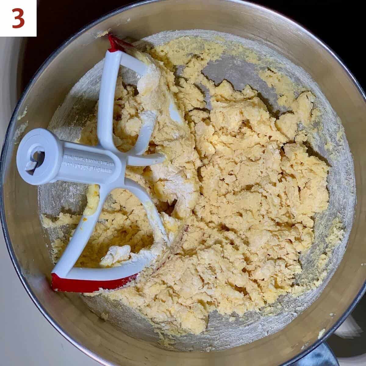 Blending flour & salt into sugar cookie dough.