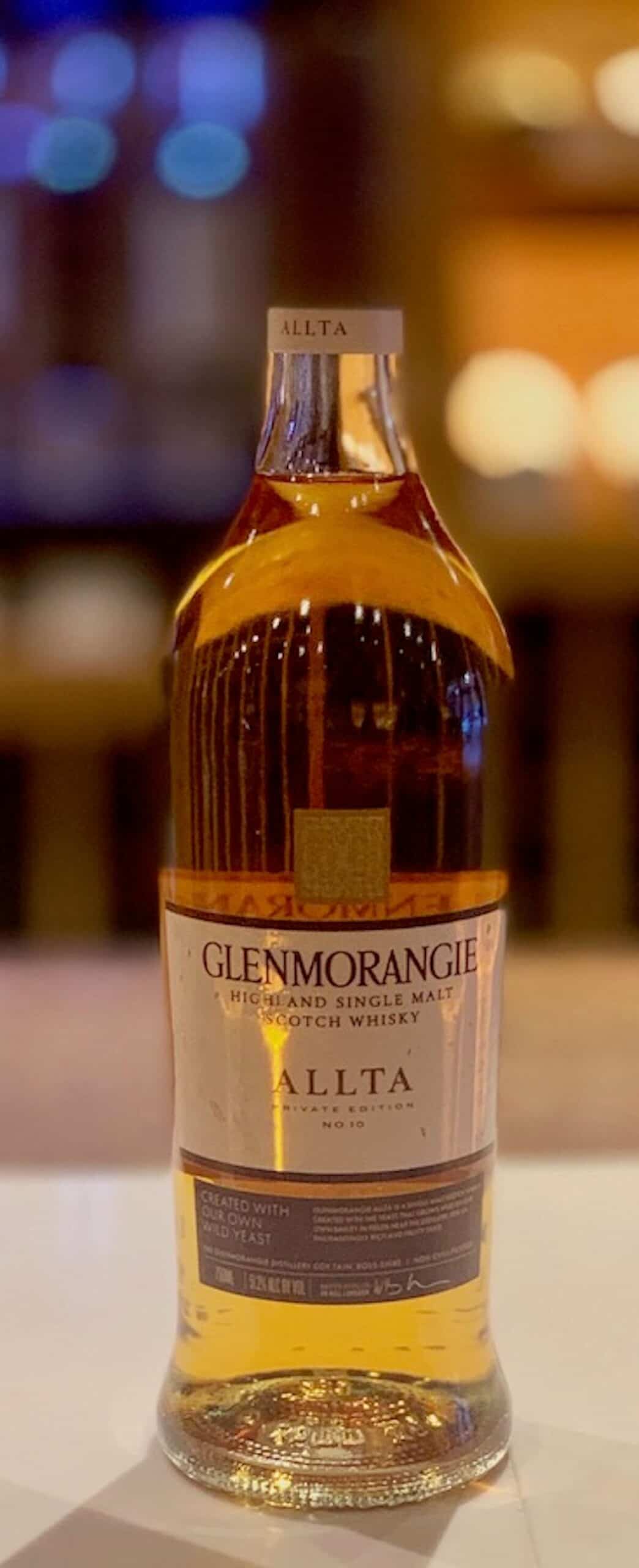 Glenmorangie Allta in bottle on a counter.