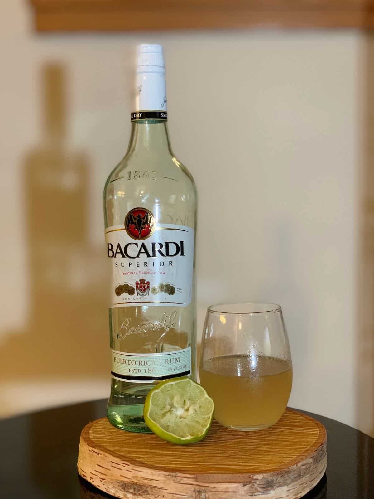Daiquiri in glass with Bacardi Rum and lime on a table.