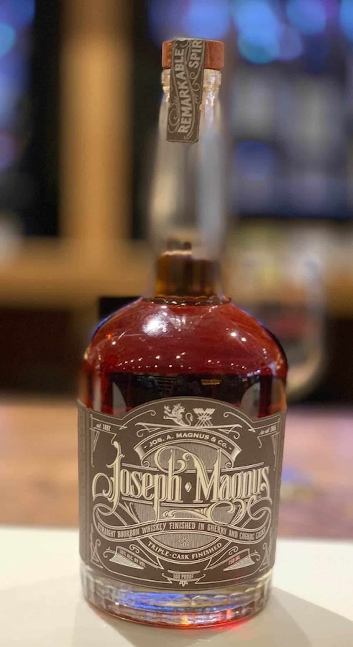 Bottle of Joseph Magnus boutbon on a counter.