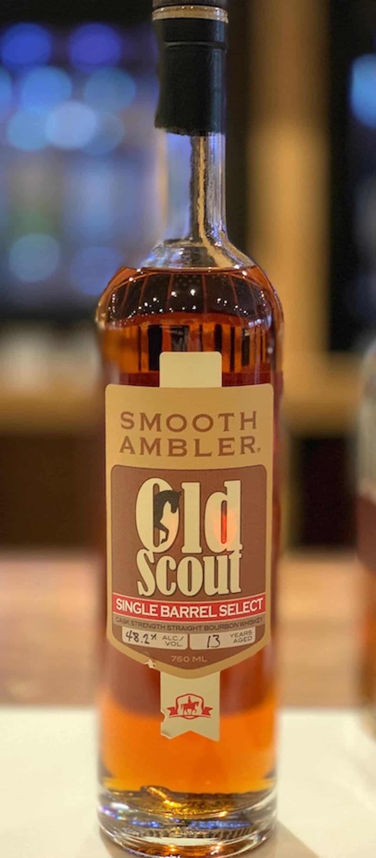 Bottle of Smooth Ambler bourbon on a counter.