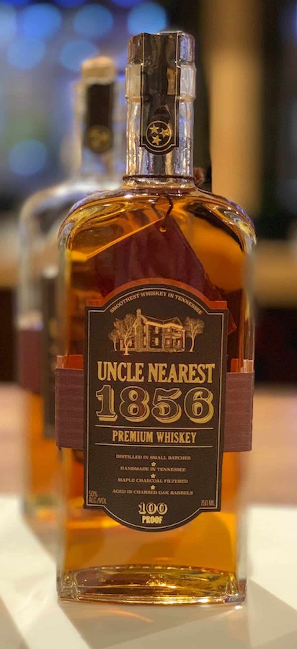 Bottle of Uncle Nearest 1856 whiskey on a counter.