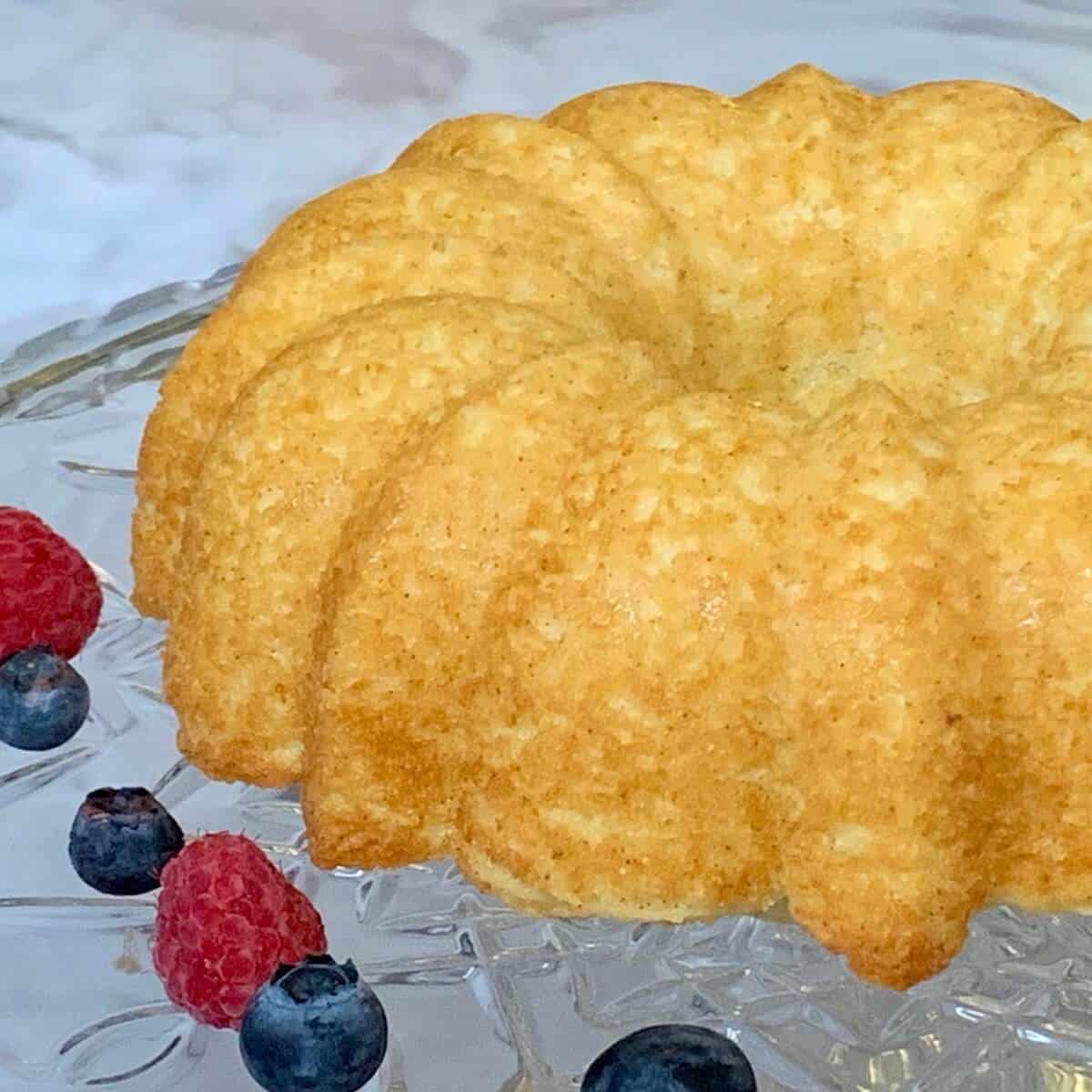 Unglazed Limoncello Cake bundt on a cake stand.