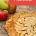 Apple galette with apples on a brown background Pinterest banner.