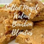 Stack of Maple Walnut Bourbon Blondies on a white plate with multicolored checks Pinterest banner.