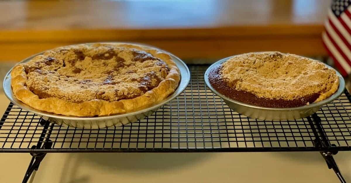 Full-sized and mini Shoofly pies on a cooling rack.