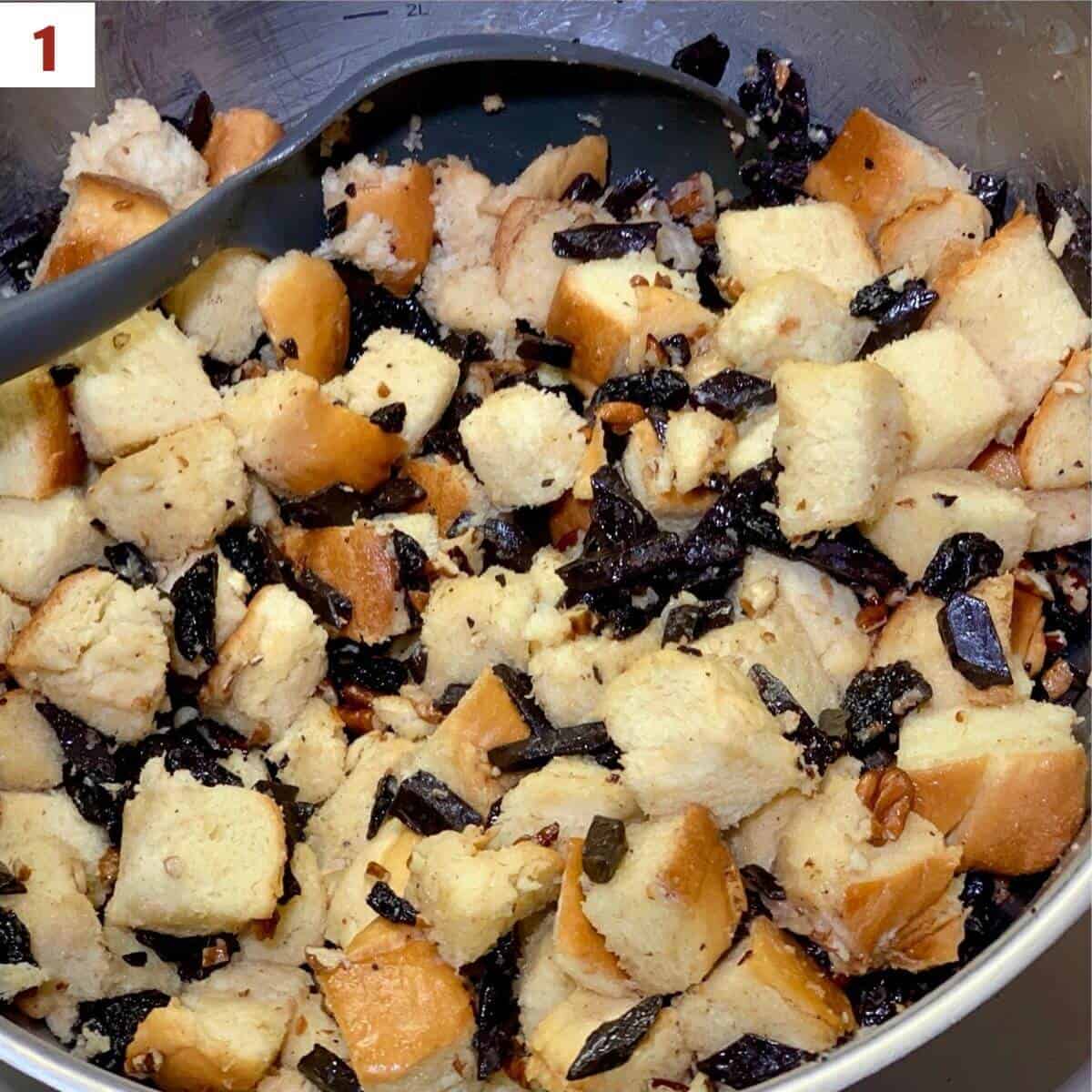 Mixing the bread, dried cherries, & chocolate chips.