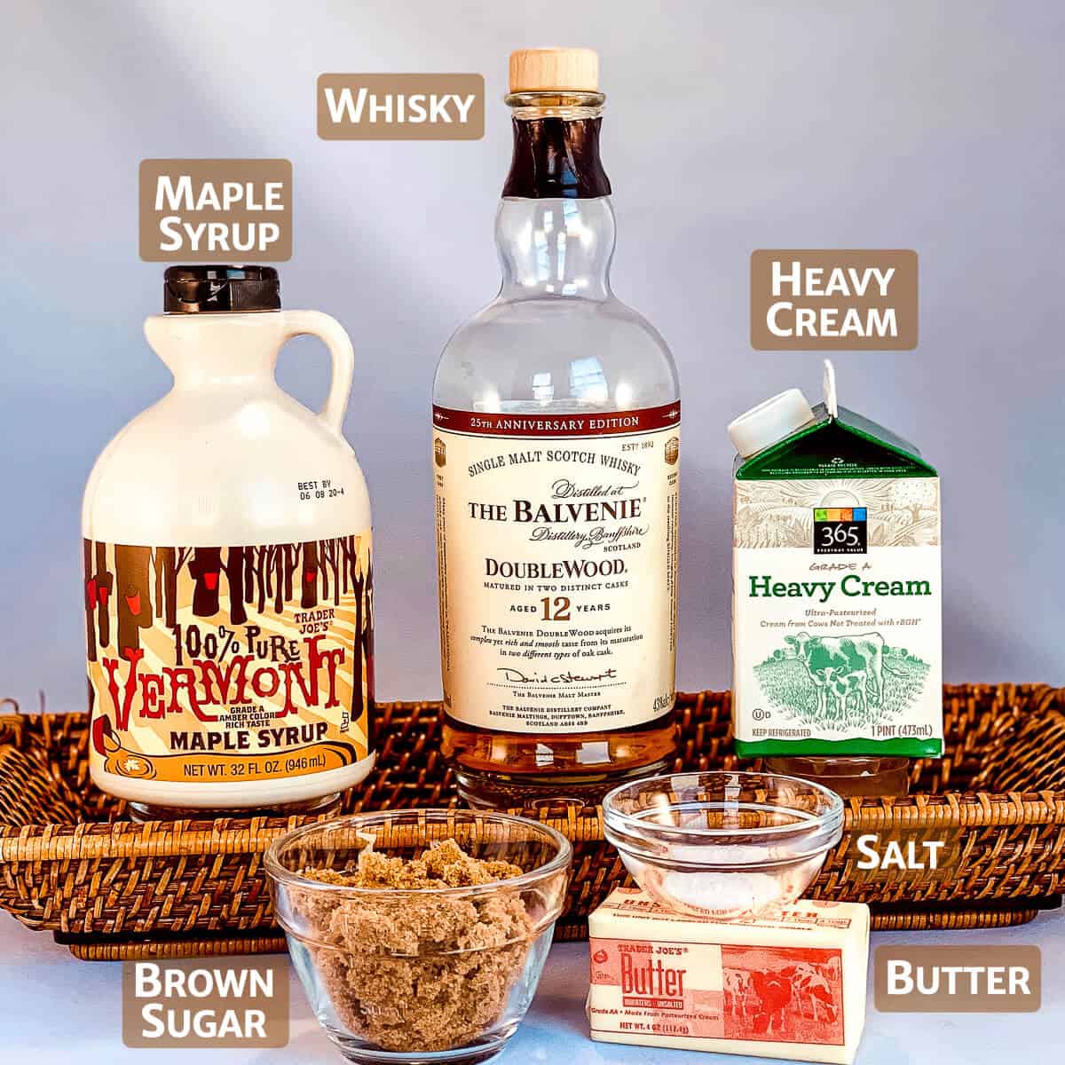 Maple whisky sauce ingredients in their packages or portoined into glass bowls.