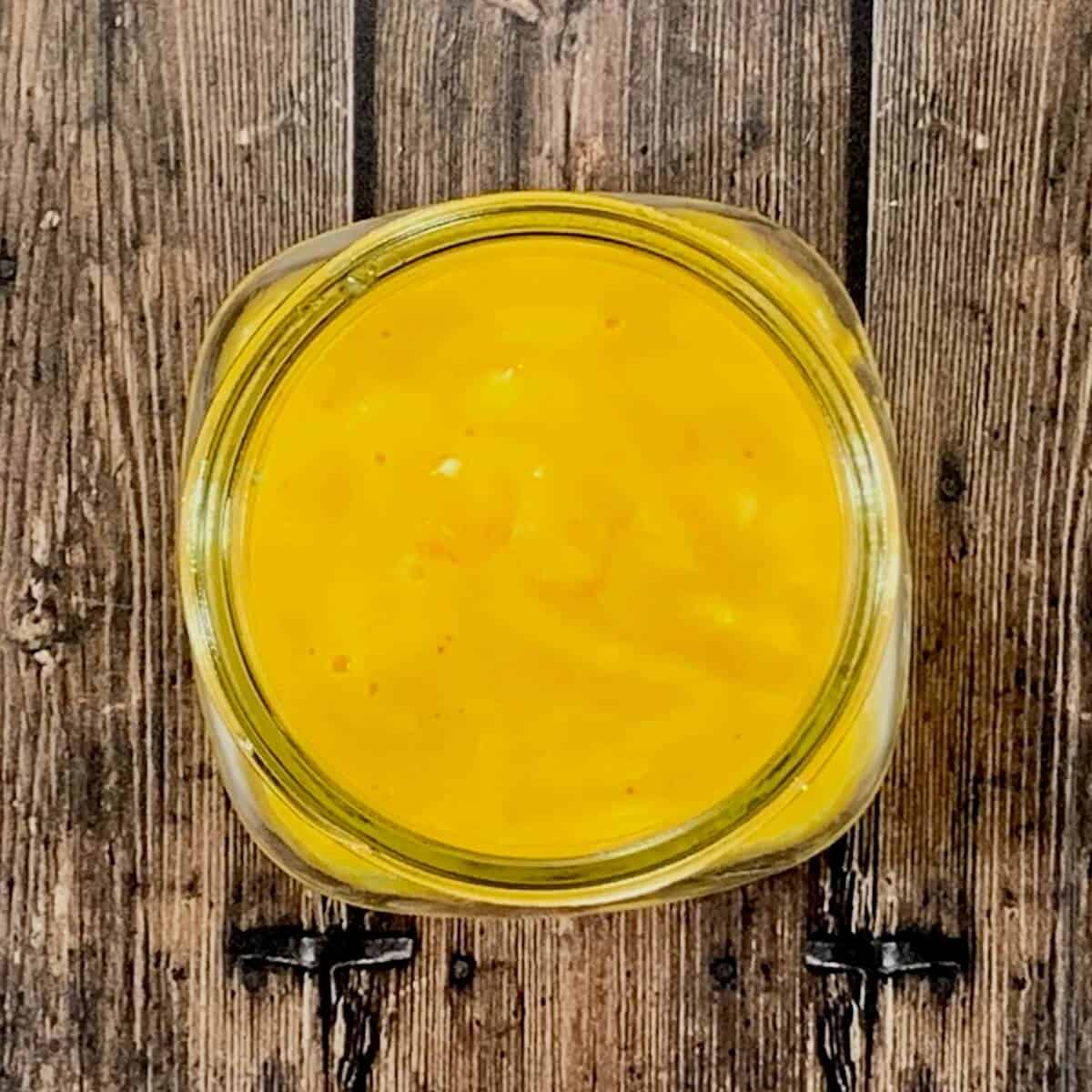 Hollandaise sauce in a jar from overhead.