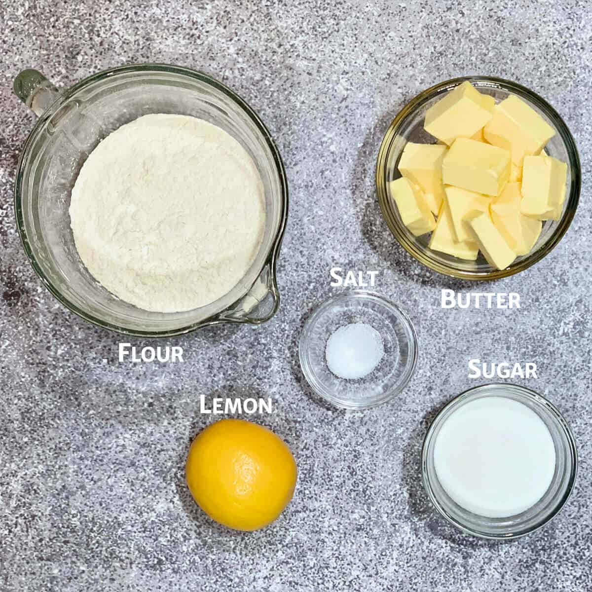 lemon shortbread ingredients portioned into glass bowls.