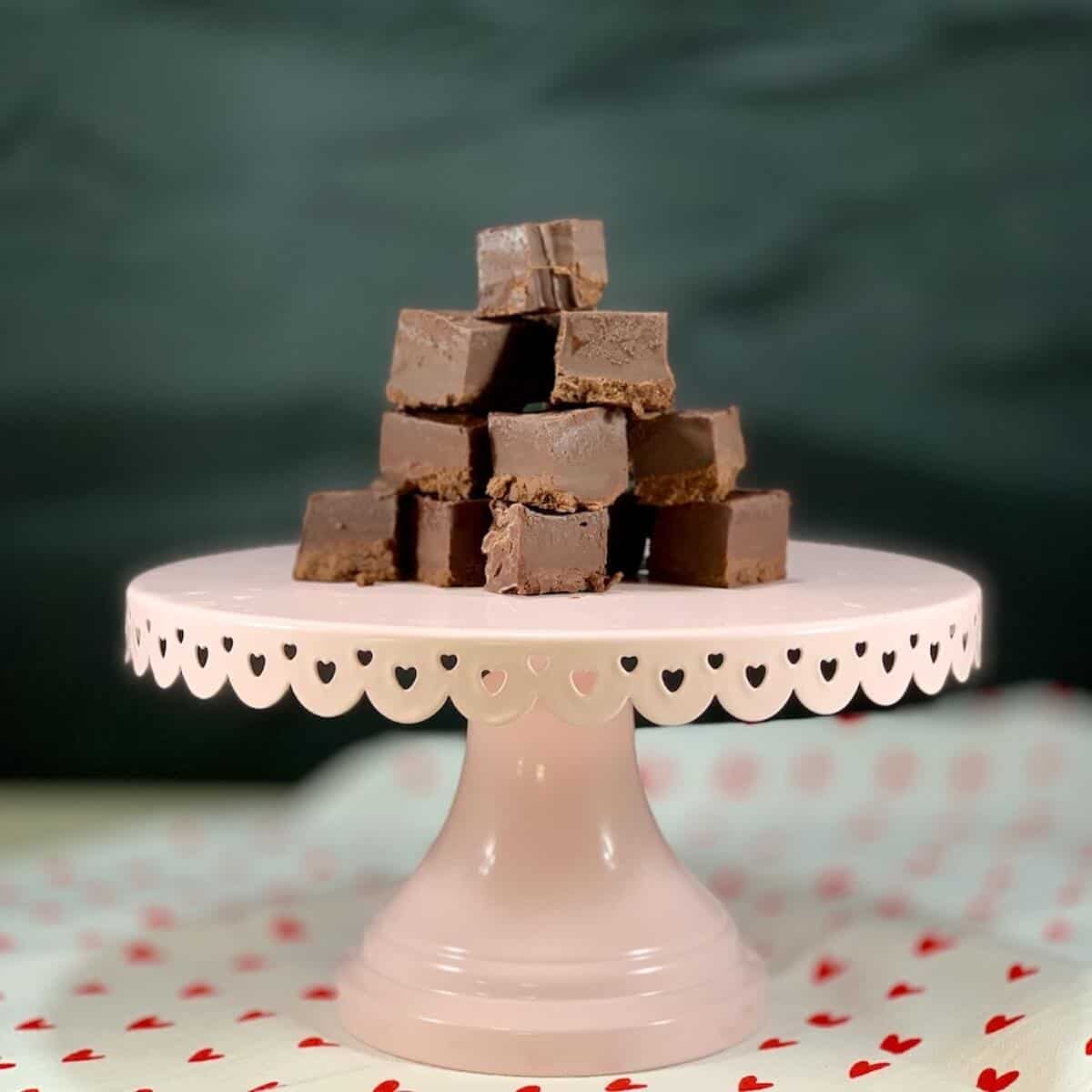 Kahlua Fudge stacked on a pink cake stand.