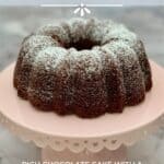 Whole Kahlua Cake on a pink cake stand Pinterest banner.
