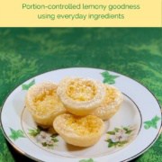 Lemon tartlets stacked on a white plate atop a green background Pinterest banner.
