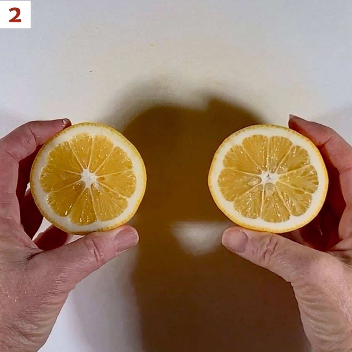 Displaying 2 cut lemon halves.