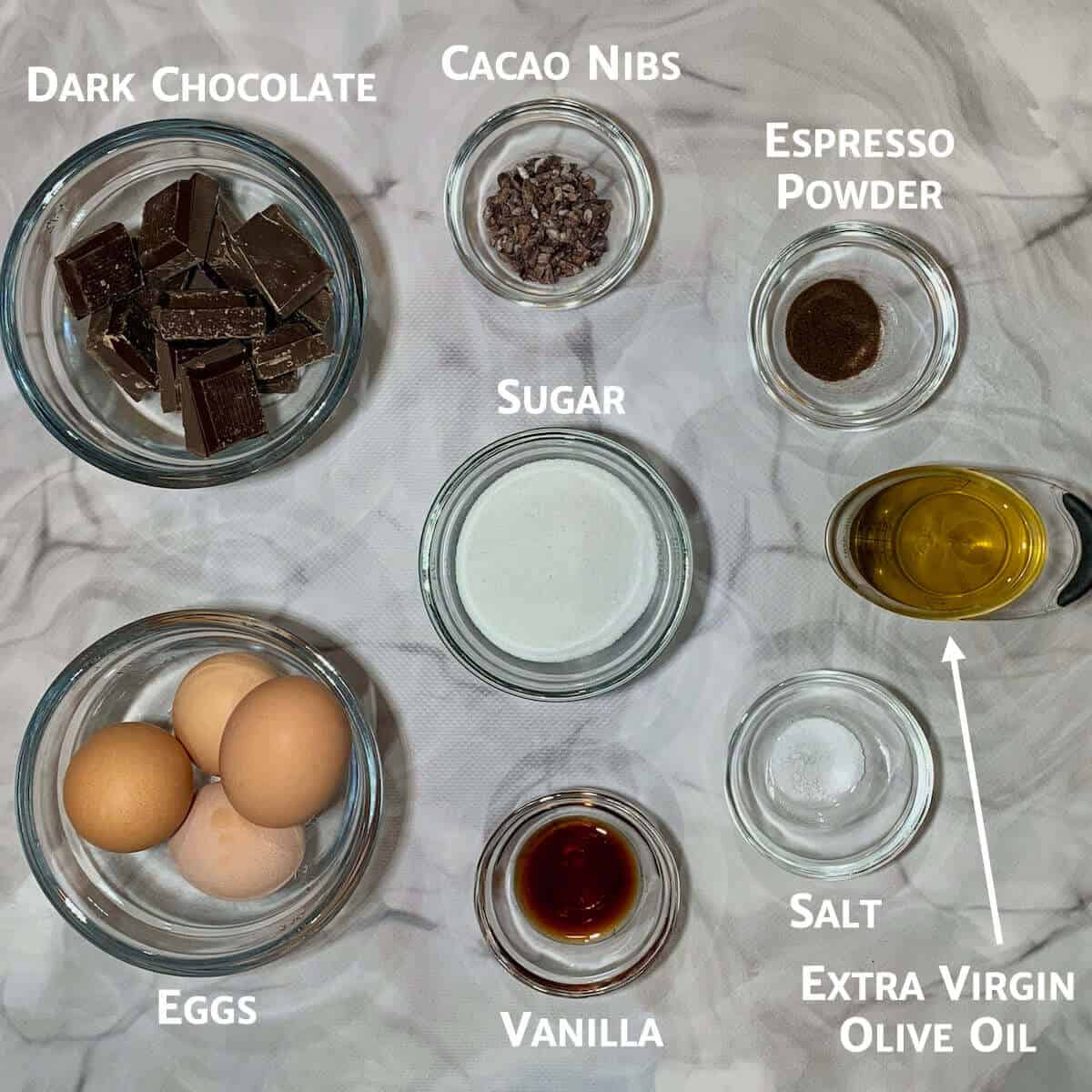 Ingredients for dairy-free chocolate mousse in glass bowls from overhead.