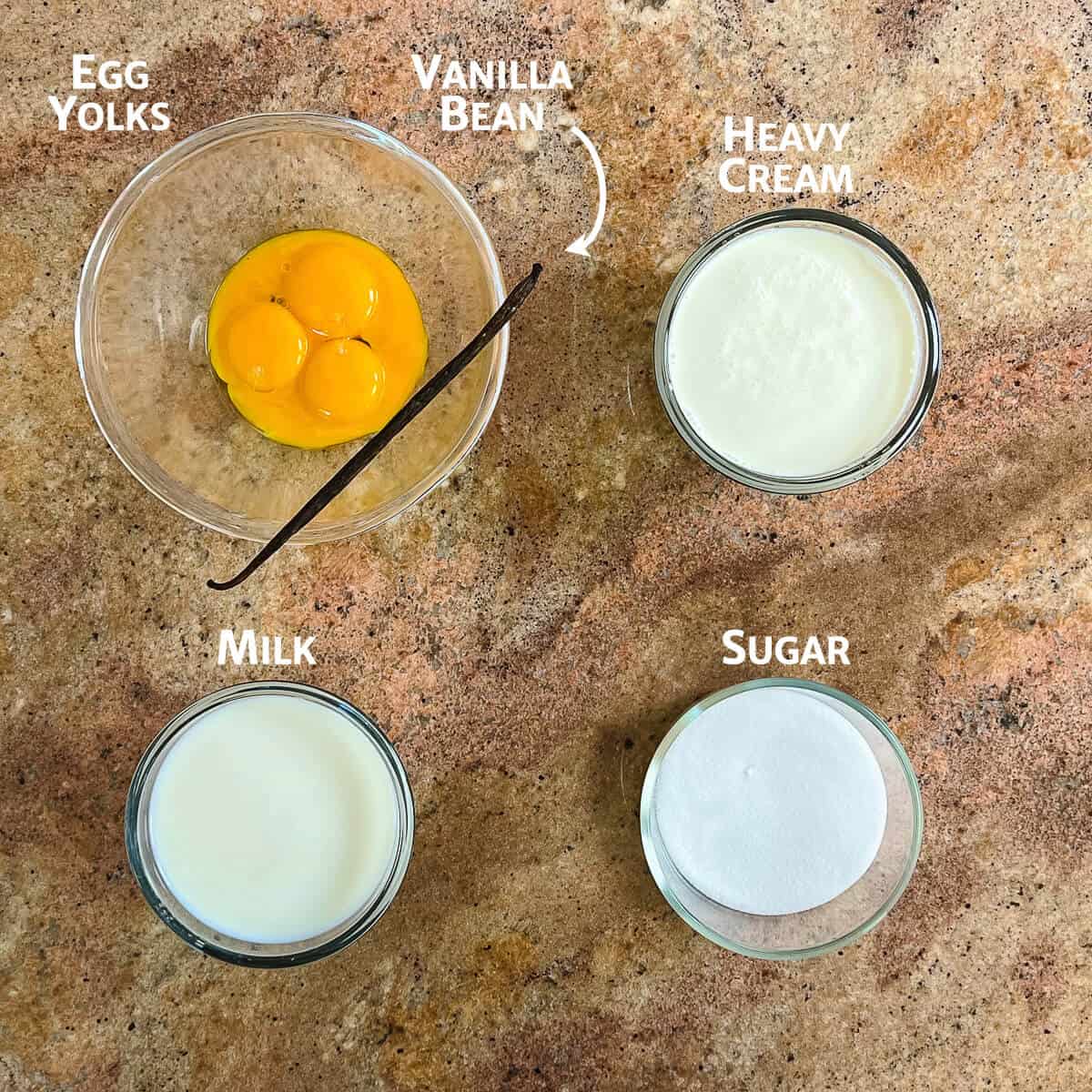French Vanilla Ice Cream ingredients portioned into glass bowls from overhead.