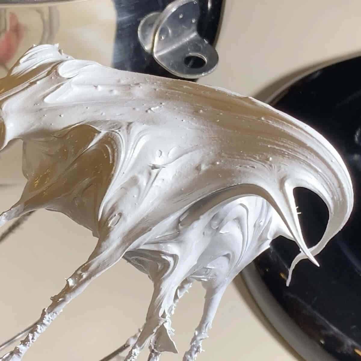 Marshmallow creme on a whisk.