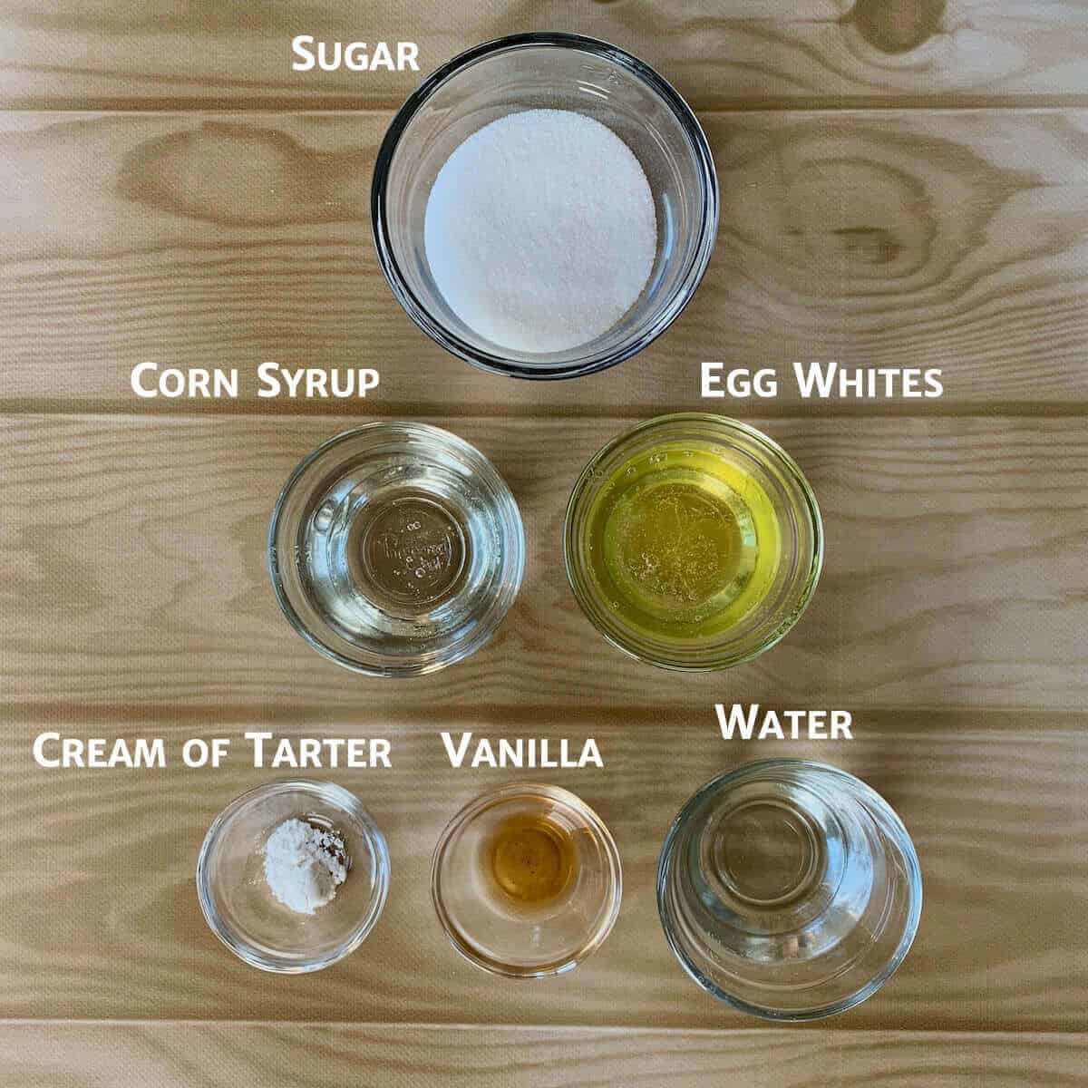 Marshmallow Creme ingredients in glass bowls on a table.