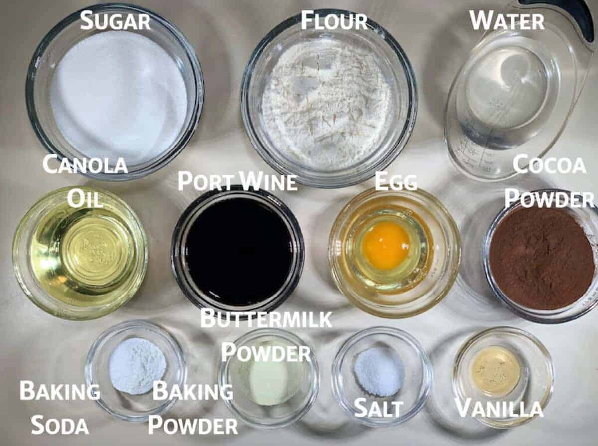 Port wine chocolate cake ingredients in glass bowls from overhead.