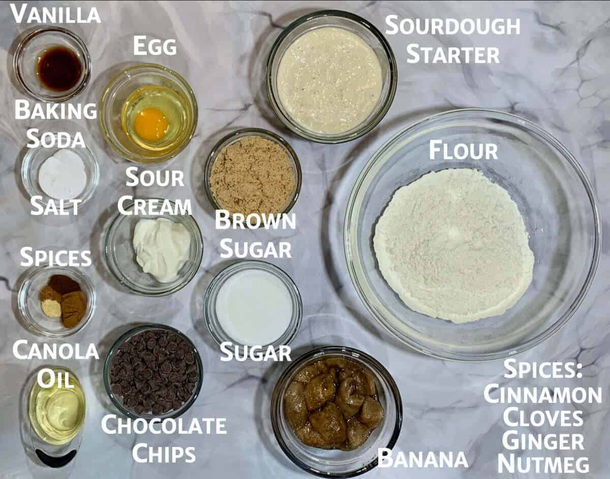 Banana bread batter ingredients portioned into glass bowls from overhead.