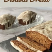 Sliced Sourdough Banana Bread loaf in foreground with whole small loaves in background Pinterest banner.