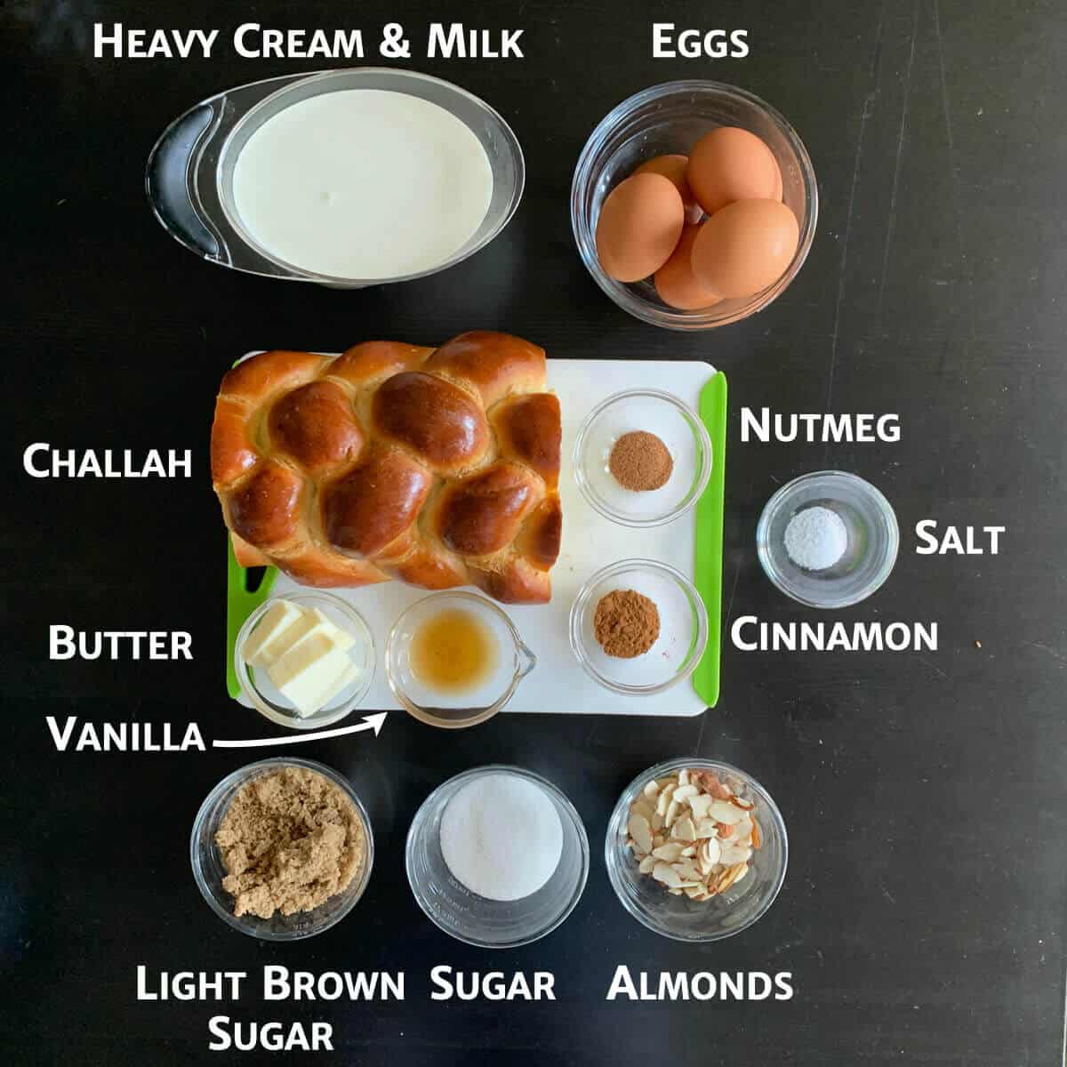 French Toast casserole ingredients portioned into glass bowls.